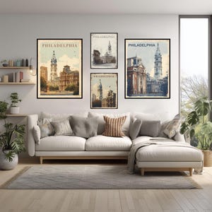 May include: A living room features a white sofa, a gray rug, and framed art prints. The prints, with black frames, display vintage-style illustrations of Philadelphia landmarks. The word "PHILADELPHIA" is printed at the top of each print.