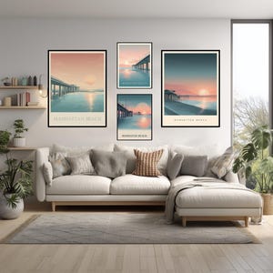 May include: A living room features a white sofa, a gray rug, and framed art prints. The art depicts a pier at sunset with the text "Manhattan Beach". The color palette includes shades of blue, orange, and beige.