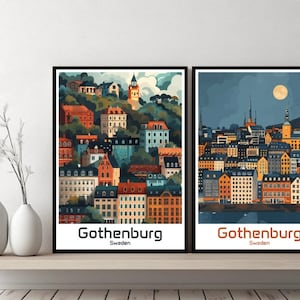 以下が含まれることがあります： スウェーデンのヨーテボリ市のイラストが2つ額装されています。最初の画像は、丘の上に教会がある、昼間の街の景色です。2枚目の画像は、満月が空にある、夜の街の景色です。どちらの画像も、街のカラフルでスタイリッシュな描写が特徴です。