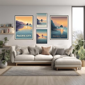 May include: Four framed art prints depicting a coastal scene at sunset. The prints feature a beach, ocean, and mountains with the text "PACIFIC CITY OREGON". The artwork is displayed above a white sofa with gray pillows.
