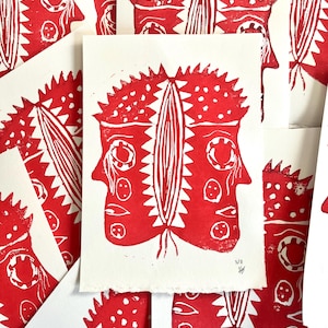 Red linocut engraved and printed by hand