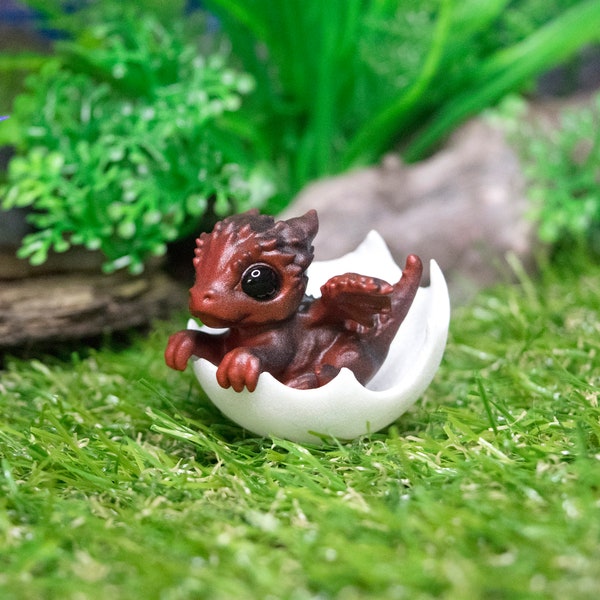 Newborn black and red dragon in egg. Hatching Dragon!