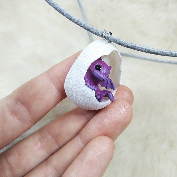 Pendant with newborn purple dragon in the egg!