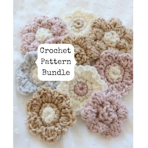 May include: A collection of crocheted flower motifs in various shades of pink, beige, and gray. The flowers are arranged on a white background and have a textured, handmade appearance. The text "Crochet Pattern Bundle" is displayed on a white label.