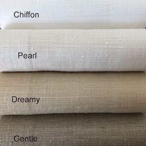 May include: Four fabric swatches in different shades of white and beige. The swatches are labeled "Chiffon", "Pearl", "Dreamy", and "Gentle".