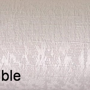 May include: White fabric with a subtle textured pattern. The fabric has a soft, smooth feel and a slightly iridescent sheen. The text "Elegance Humble" is printed in black at the bottom of the image.