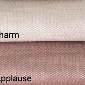 May include: Two fabric swatches, one a light pink and the other a darker pink. The top swatch is labeled "Vitality Charm" and the bottom swatch is labeled "Vitality Applause".