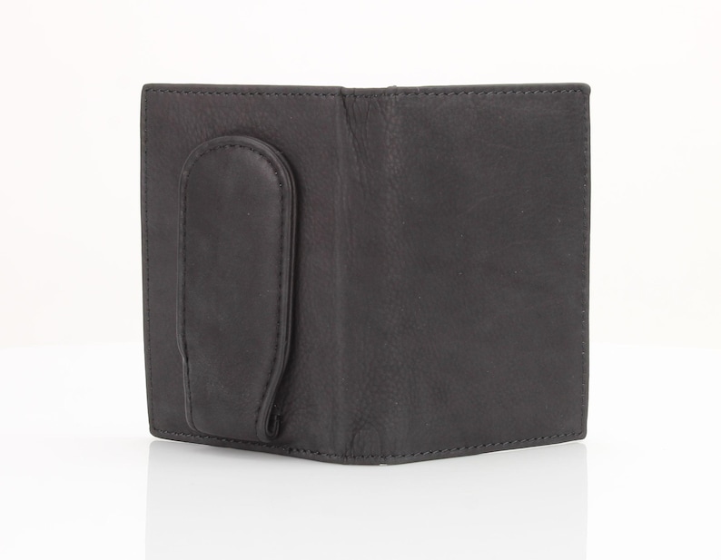 May include: A black leather wallet with a money clip. The wallet has a smooth, textured surface and a simple design.