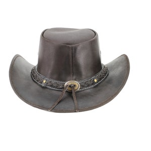 May include: A brown leather cowboy hat with a braided leather band and a metal buckle. The hat has a wide brim and a pointed crown.