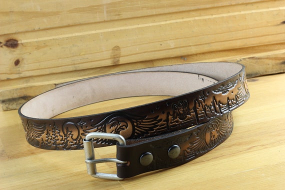 Leather belt bag with all-over embossed eagle