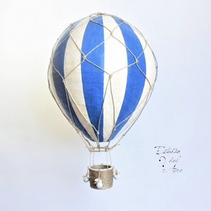 Hanging hot air balloon blue and white of papier mache. Basket, net and bags handmade in Spain. Vintage model travel and fantasy.