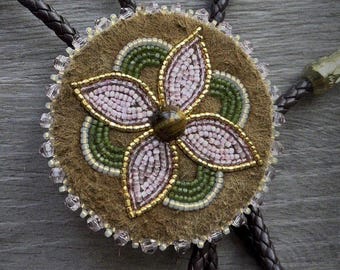 Beaded Bolo tie: 1910's beads, 24Karat gold, genuine tigers eye, and smoked, braintanned moose hide