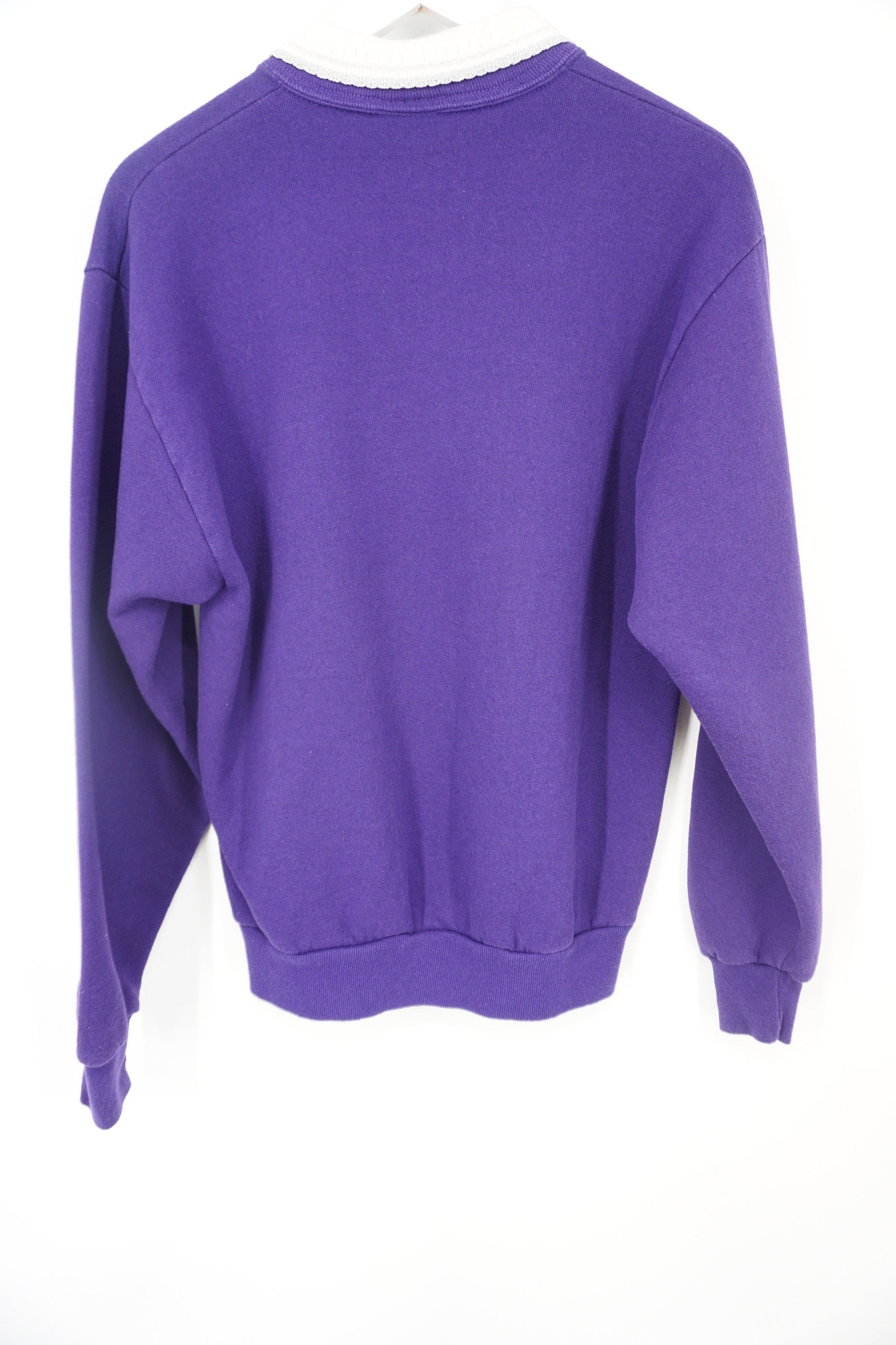 purple sweatshirt with sun