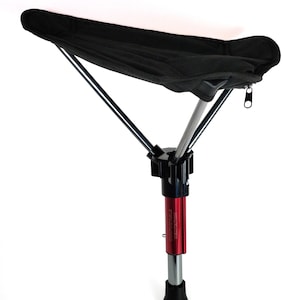 May include: A black portable tripod stool with a black seat and silver legs. The center pole is red with black and silver accents. The stool is designed for outdoor use and is lightweight and foldable.