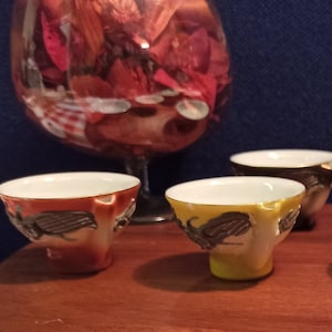 Set of 6 Porcelain Japanese Sake Whistling Cups. Raised Decoration. Good Condition.