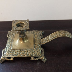 Antique Brass Footed Chamberstick. Very Ornate. Very Good Condition.