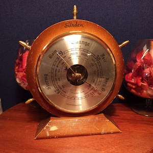 Silsden Weathermaster Barometer. In The Shape of A Ships Wheel.