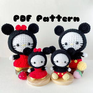 May include: Crochet amigurumi pattern for a family of four Mickey Mouse and Minnie Mouse characters. The pattern includes instructions for making a large Mickey Mouse, a large Minnie Mouse, a smaller Mickey Mouse, and a smaller Minnie Mouse. The characters are all wearing their signature red and black outfits.