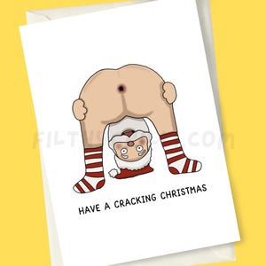 May include: A funny Christmas card with a cartoon Santa Claus in a bent-over position, showing his backside. Santa's legs are in red and white striped socks. The text "HAVE A CRACKING CHRISTMAS" is printed below the illustration.