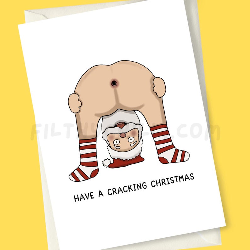May include: A funny Christmas card with a cartoon Santa Claus in a bent-over position, showing his backside. Santa's legs are in red and white striped socks. The text "HAVE A CRACKING CHRISTMAS" is printed below the illustration.
