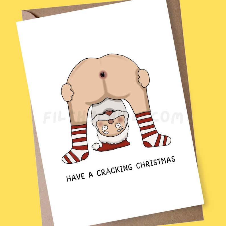 May include: A funny Christmas card with a cartoon Santa Claus bent over, showing his bottom. Santa's face and legs are visible, with red and white striped socks. The text "HAVE A CRACKING CHRISTMAS" is printed below the image.