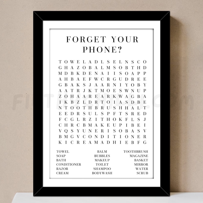 May include: A black and white word search puzzle with the words "Forget Your Phone?" at the top. The puzzle includes words related to bathroom and beauty products, such as "towel", "soap", "toothbrush", "body wash", "makeup", and "conditioner".