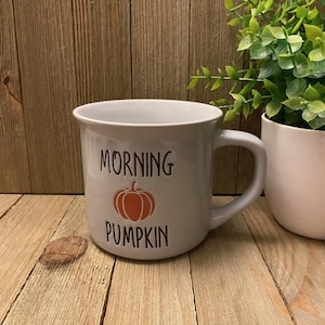 May include: A rustic wooden sign with the text "Welcome to our home" in white lettering. The sign features a distressed finish and a simple, inviting design, perfect for entryway decor.