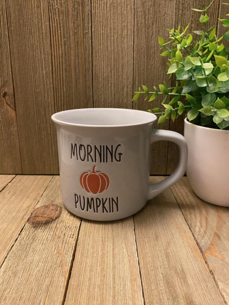 May include: A rustic wooden sign with the text "Welcome to our home" in white lettering. The sign features a distressed finish and a simple, inviting design, perfect for entryway decor.