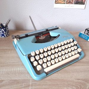 Blue Olympia Splendid 99 Typewriter