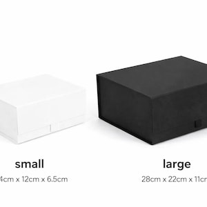 May include: A small white rectangular gift box and a large black rectangular gift box. The small box is labeled with the text small and dimensions 14cm x 12cm x 6.5cm. The large box is labeled with the text large and dimensions 28cm x 22cm x 11cm.