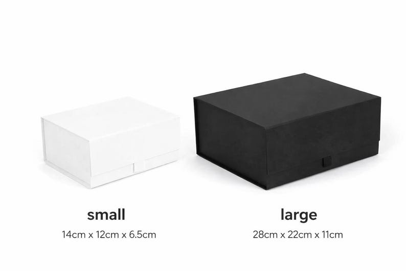 May include: A small white rectangular gift box and a large black rectangular gift box. The small box is labeled with the text small and dimensions 14cm x 12cm x 6.5cm. The large box is labeled with the text large and dimensions 28cm x 22cm x 11cm.