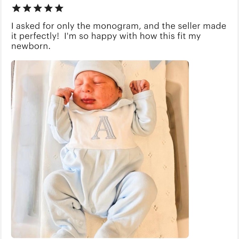 May include: A newborn baby wearing a light blue onesie and matching cap. The onesie features a white bib with a gray embroidered letter "A". The text above the baby reads: "I asked for only the monogram, and the seller made it perfectly! I'm so happy with how this fit my newborn."