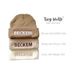 Three color options of beanies: ivory, beige, and brown.