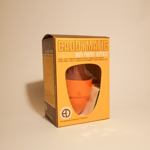 Orange Boxed Unused Caddy-Matic Junior Multi-Purpose Dispenser (Caddy-Matic by Arthur Douglas)