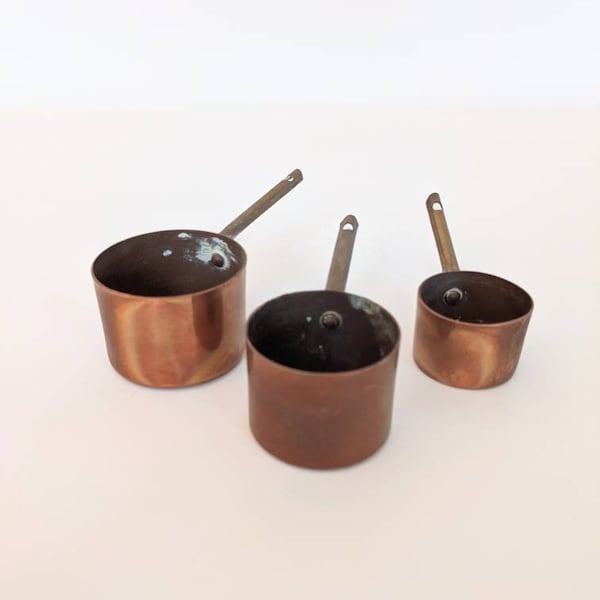 Nest of Antique Miniature Copper Saucepans