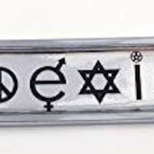 May include: A silver-colored metal bar with the word "Coexist" and symbols representing different religions and peace. The bar has a rectangular center with rounded ends and circular holes on each end.