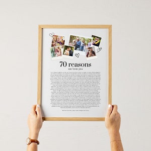 May include: A framed print with the text "70 reasons we love you" and several small photos. The frame is light brown, and the print has a white background with black text. The photos are arranged above the text.