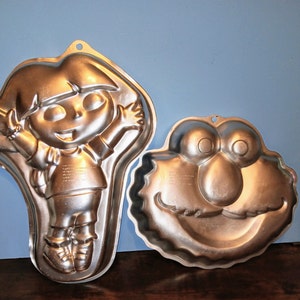 Wilton Aluminum Mold Cake Pan Elmo Face or Dora The Explorer Cake Pan used Sold as each image 1