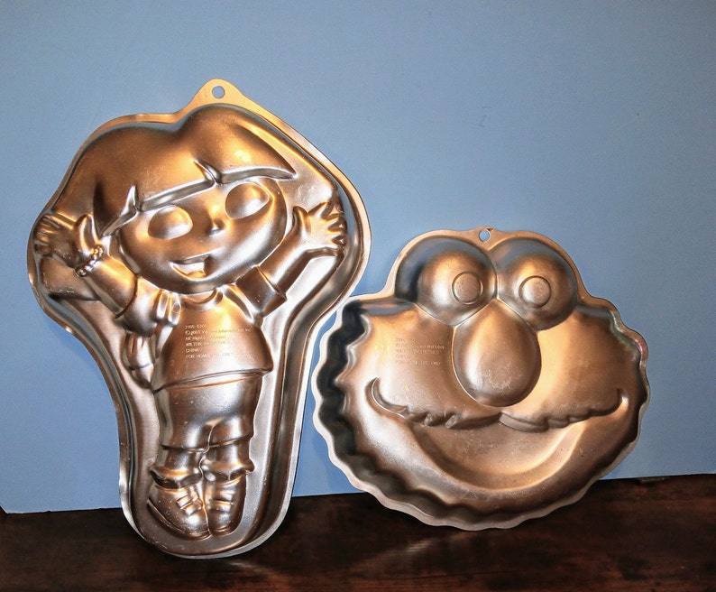 Wilton Aluminum Mold Cake Pan Elmo Face or Dora The Explorer Cake Pan used Sold as each image 1