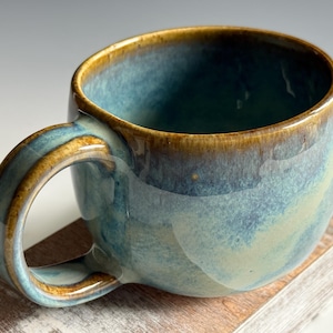 May include: A rustic wooden sign with the text "Welcome to our home" in white lettering. The sign features a distressed finish and a simple, inviting design, perfect for a front porch or entryway.