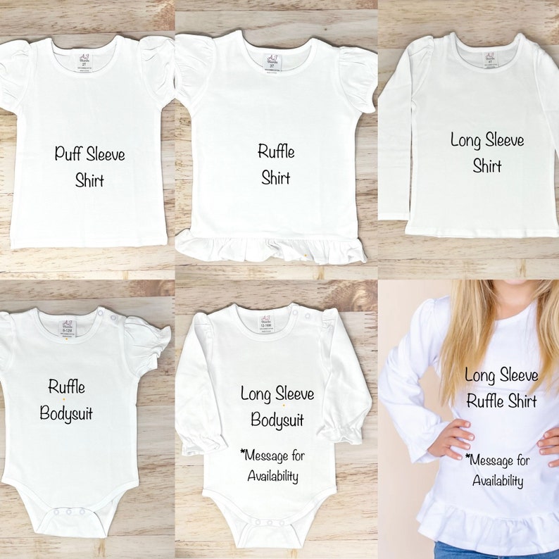 May include: Five different styles of white baby shirts and onesies. The shirts include puff sleeve, ruffle sleeve, and long sleeve options. The onesies include a ruffle and long sleeve option. The text on the shirts reads "Puff Sleeve Shirt", "Ruffle Shirt", "Long Sleeve Shirt", "Ruffle Bodysuit", "Long Sleeve Bodysuit", and "Long Sleeve Ruffle Shirt".