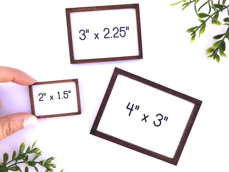May include: Three small wooden frames with white inserts. The frames are labeled with their dimensions: 3" x 2.25", 2" x 1.5", and 4" x 3". The frames have a dark brown finish.