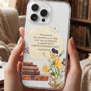 May include: Clear phone case with a floral design and a quote by Jane Austen. The case features a stack of books, yellow and purple flowers, and a butterfly. The quote reads: "The person, be it gentleman or lady, who has not pleasure in a good novel, must be intolerably stupid."