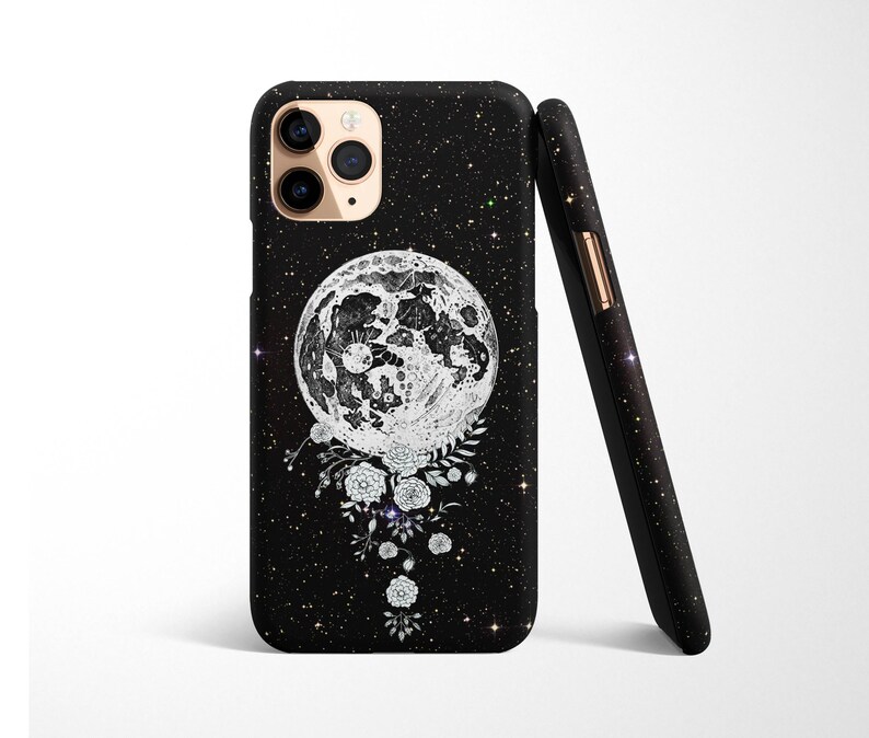 May include: Black phone case with a white moon and floral design on a black glitter background.