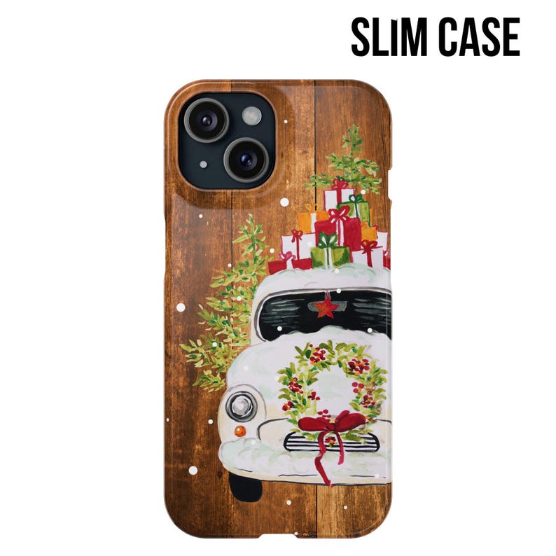 May include: A white vintage car with a wreath on the front bumper, carrying a stack of Christmas presents on top. The car is on a woodgrain background with snowflakes.