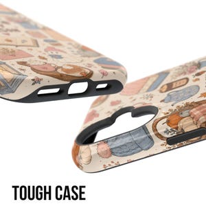 May include: A phone case with a cream background featuring a repeating pattern of autumn-themed illustrations including pumpkins, hot beverages, books, and knitted hats. The case has a black inner lining and precise cutouts for ports and camera.
