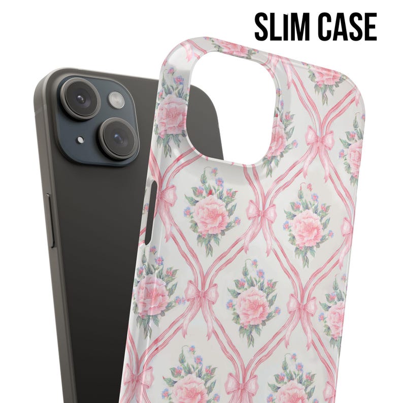 May include: A clear phone case with a pink and white floral pattern. The case has a repeating pattern of pink bows and pink flowers on a white background. The case is designed to fit a smartphone.