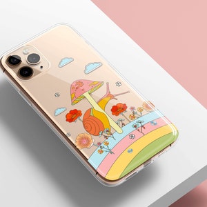 May include: Clear phone case featuring a whimsical illustration of a snail with a mushroom cap, flowers, and a rainbow. The design has a retro, psychedelic vibe. The case is designed for a smartphone.