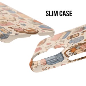 May include: A slim case phone cover featuring a cream background with a repeating pattern of autumn-themed illustrations including pumpkins, ghosts, hot beverages, books, and lanterns. The text SLIM CASE is printed in black in the upper right.