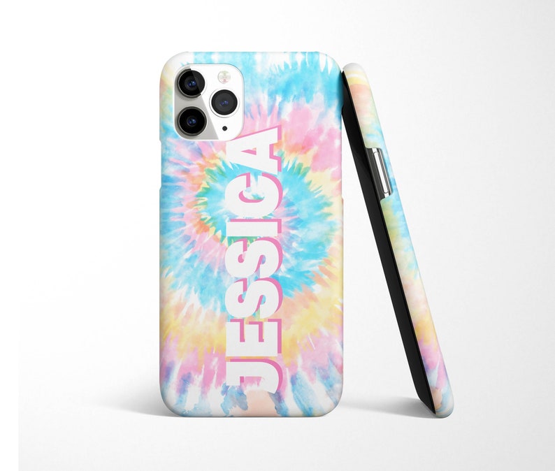 May include: A phone case with a tie-dye pattern in shades of blue, pink, and yellow. The name "JESSICA" is printed in white with a pink outline on the case.